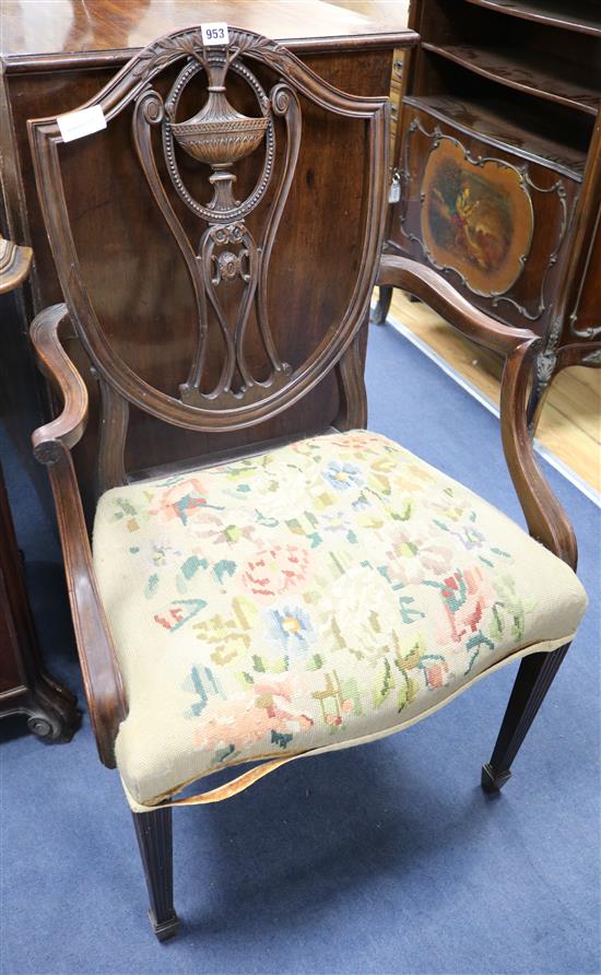 A pair of Hepplewhite style mahogany elbow chairs